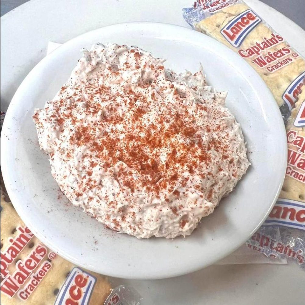 A house dip served with crackers