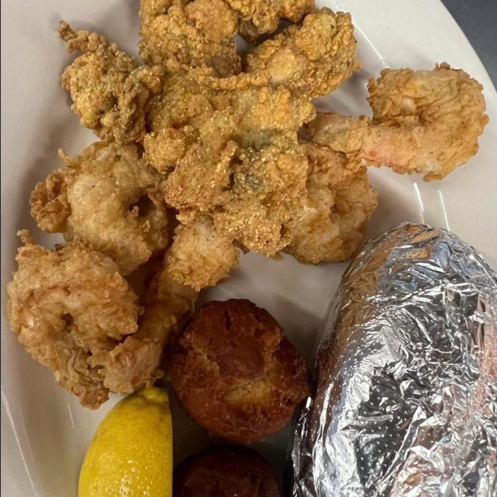 Fried jumbo shrimp and oysters with hushpuppies