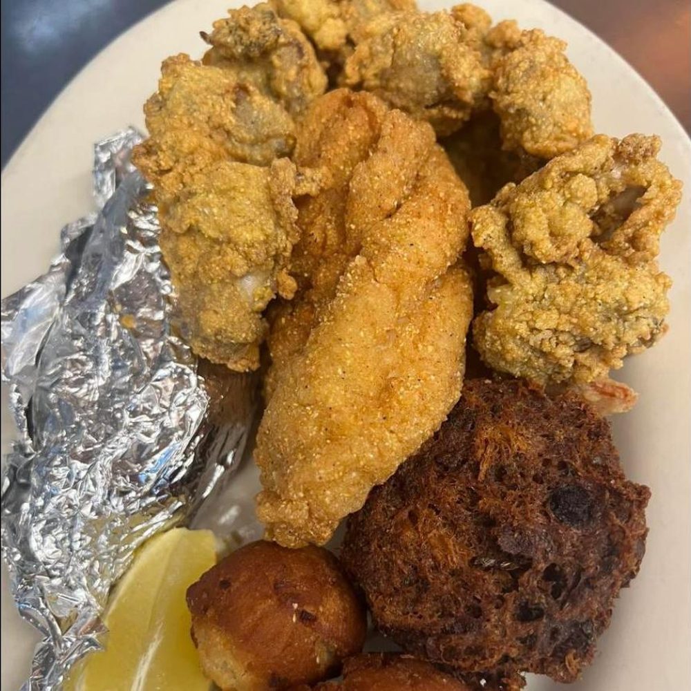 Fried seafood platter with catfish, oysters, shrimp and hushpuppies