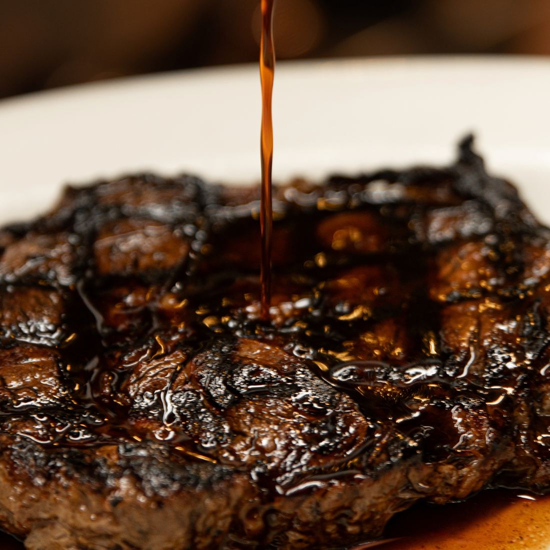 Jus poured over a charbroiled hand-cut ribeye